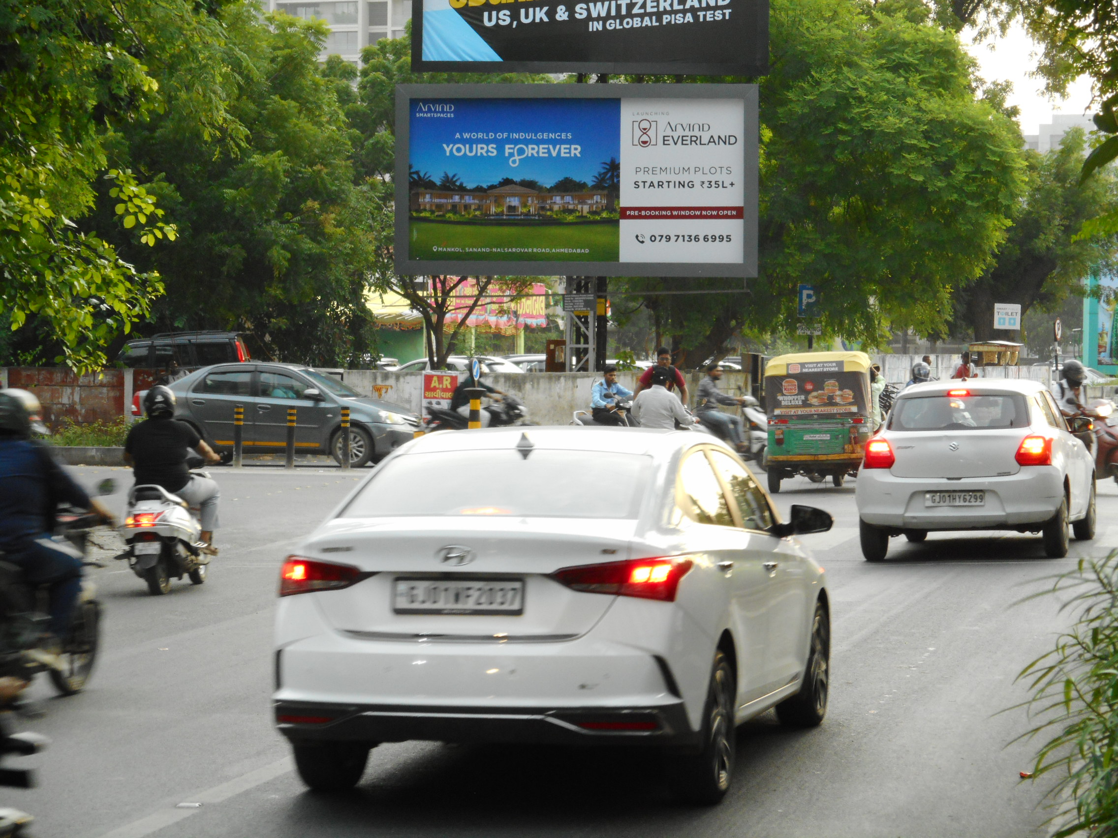 Prahladnagar Road, Outside Starbucks Tow. SG Road